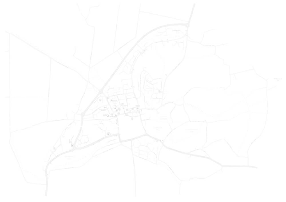 A faint, minimalistic map outline showing roads and boundaries with no visible labels or details, on a white background.